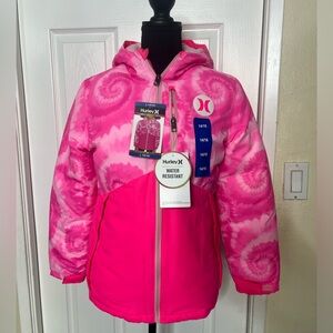 HURLEY Girl’s pink water resistant snow jacket. Fleece lined with media pocket.